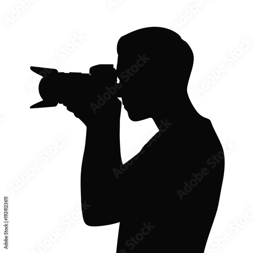 Silhouette of a photographer taking a picture with a dslr camera