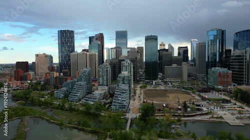 Wallpaper Mural Calgary skyline panoramic view showing modern skyscrapers and residential buildings along Bow River Torontodigital.ca