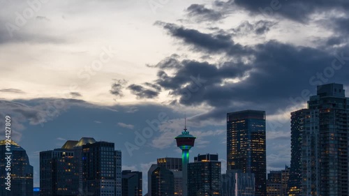 Wallpaper Mural Timelapse of Calgary city skyline with skyscrapers and tower against a dramatic cloudy sunset in Alberta, Canada Torontodigital.ca