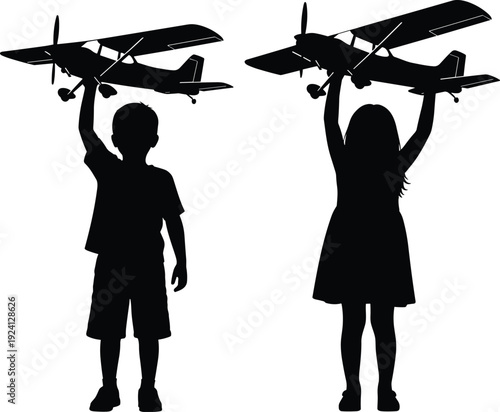 Black vector silhouette of a young boy and girl holding up large toy model airplanes for childhood dreams aviation play and future pilot aspirations