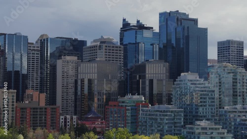 Wallpaper Mural Calgary city skyline featuring urban architecture and modern skyscrapers against a cloudy sky Torontodigital.ca