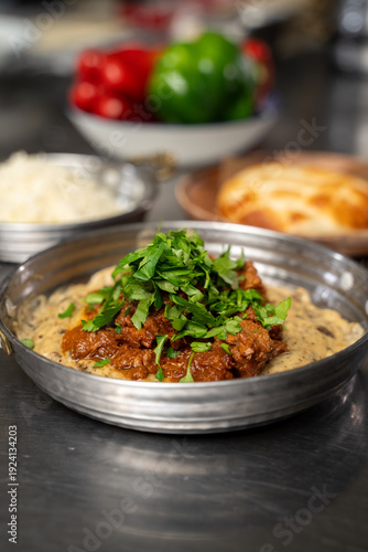 Wallpaper Mural Close up of beef dish with parsley in metal pan Torontodigital.ca