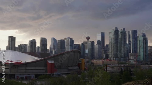 Wallpaper Mural Calgary cityscape showcasing modern skyscrapers and the Calgary Tower under a cloudy sunset sky Torontodigital.ca