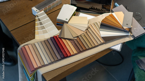 Foto selection of fabric and color of curtains, textiles and furniture, beige satin