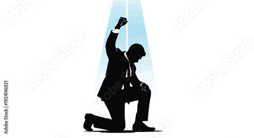 Silhouette of a businessman kneeling with fist raised in triumph.