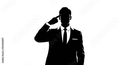 Silhouette of a businessman making a gun gesture to his head.