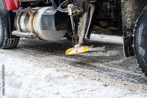 Obraz na plátně Close up of salt spreading equipment on snow plow truck during winter