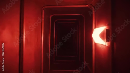 Red Light Illuminates Dark Tunnel Creating Surreal Atmospheric Depth