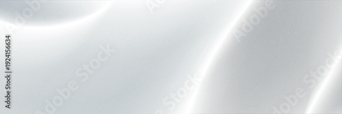 Elegant abstract white background featuring soft smooth wave shapes with subtle gradients and gentle shadows.