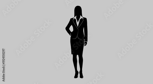 Silhouette of a confident businesswoman in a professional suit.