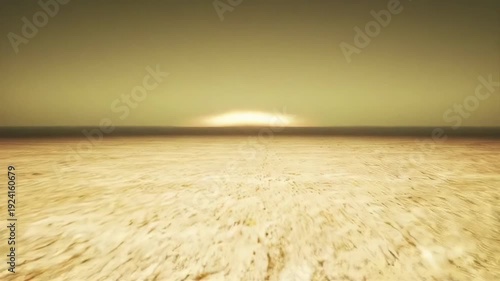 Sunset Illuminates Ocean Horizon with Tranquil Beach Landscape