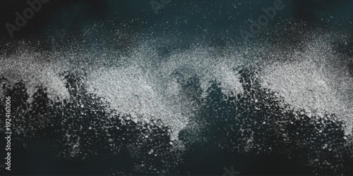 Flour spilling on black background. Abstract design of white powder cloud. Abstract wallpaper design of white color shiny snow dust powder isolated on black background .


