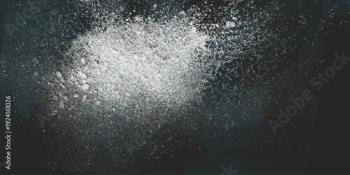 Flour spilling on black background. Abstract design of white powder cloud. Abstract wallpaper design of white color shiny snow dust powder isolated on black background .



