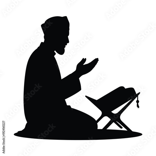 Silhouette of a muslim man praying with a book on a stand a spiritual scene