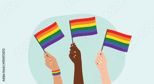 Three diverse hands are raised, proudly waving colorful rainbow flags to celebrate Pride Month and support the LGBTQ+ community.