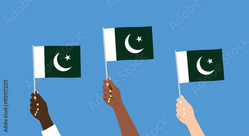 Diverse hands from different ethnic backgrounds are raised together, holding and waving flags of Pakistan against a blue background.