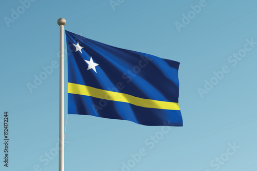 Curacao national flag waving on pole against clear blue sky background.