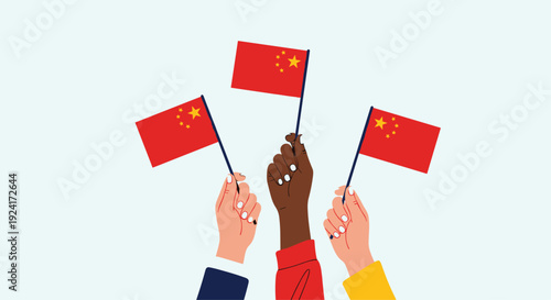 Three diverse hands are raised up, holding and waving the national flag of the People's Republic of China in celebration.