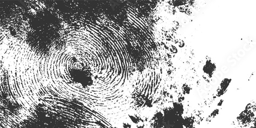 Close up of a black and white fingerprint texture with swirling patterns and speckled details