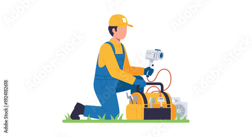 A male technician wearing a yellow hard hat and blue overalls kneels on a green grass strip while holding a thermal scanner next to a tool bag.