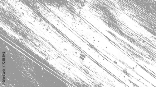 Abstract grey and white distressed diagonal brush stroke texture with speckled imperfections background