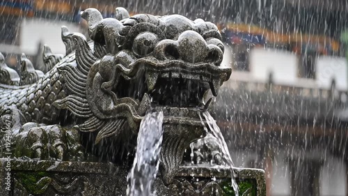 Stone Dragon Fountain Sculpture Underneath Falling Rain With Water Flowing From Mouth Detailed Sculpture With Water Droplets