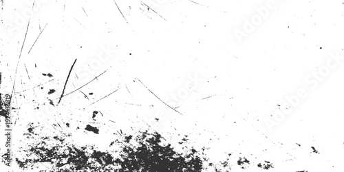 Black ink splatters and fine scratches on a white textured background