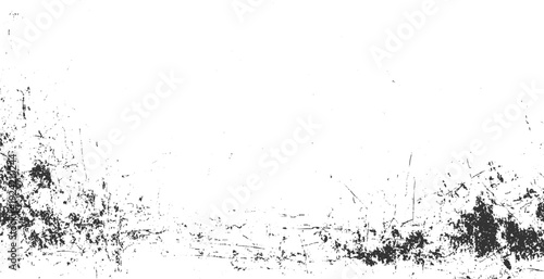 Black ink splatters and scratches on a white background creating a distressed texture abstract