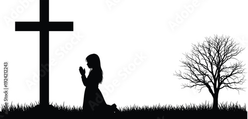 Silhouette of a woman kneeling in prayer beside a cross and bare tree