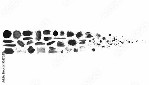Black stones and pebbles scattered on white background.