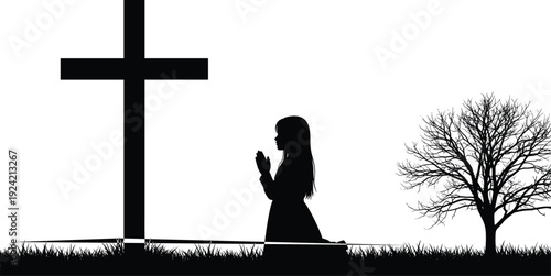 Silhouette of a woman praying beside a cross and bare tree