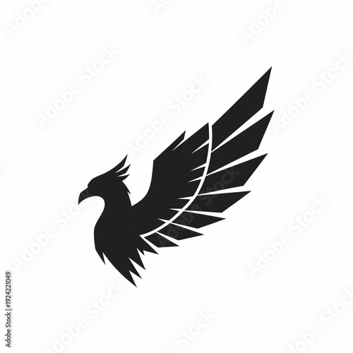 Black eagle silhouette with extended wing symbol of freedom and strength