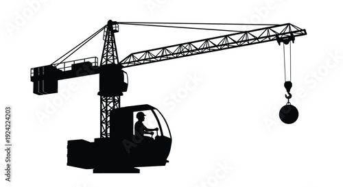 Black silhouette of a large construction crane with a suspended load