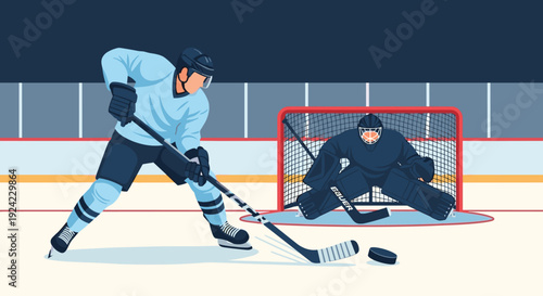 Ice hockey player in a light blue uniform prepares to shoot the puck towards the opposing team's goalie who is ready to defend the net on the rink.