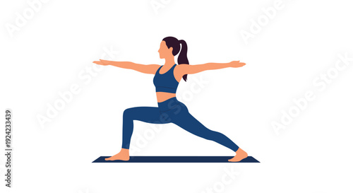 Young woman with her hair in a ponytail practices yoga in the Warrior II pose on a mat, wearing a blue workout set.