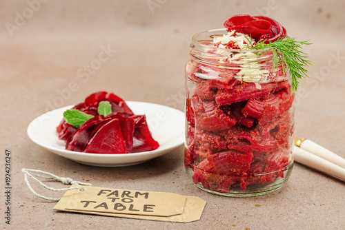 Fermented beetroot pasta salad in a jar with sliced beets. Probiotics and healthy plant-based eating