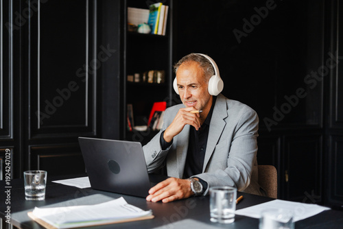 Person utilizing laptop during conference