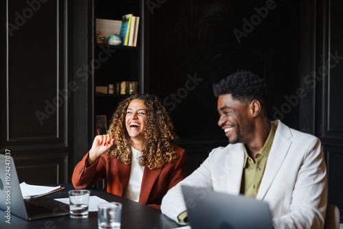 Colleagues attend a meeting