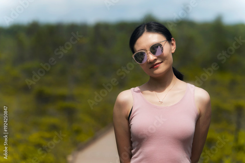 A smiling chinese woman within orono bog in bangor Maine