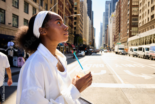 Woman crosses the boulevard in NYC