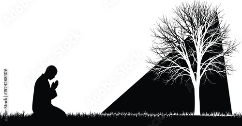 Silhouette of a person praying next to a bare tree