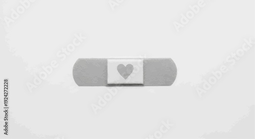 A simple gray band aid with a heart on the center strip on a white background