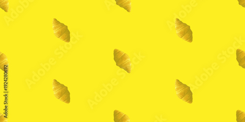 Seamless pattern of fresh golden croissants on a vibrant yellow background. Minimalist pop art food design for a bakery or cafe