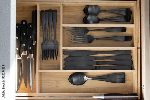 Silverware Dividers with silverware and utensils organized