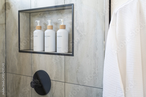 Minimalist Bathroom Interior with White Towels and Toiletries and greenery on white background
