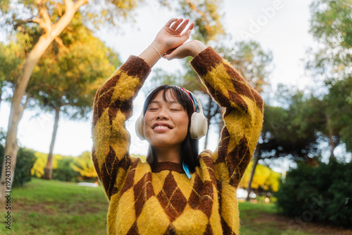 Happy woman enjoys music