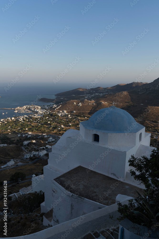 Fototapeta premium Aerial View of a Greek Island with White Wash Church
