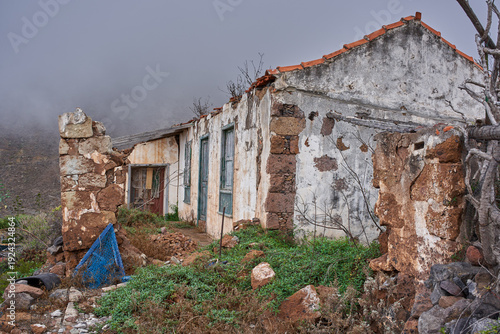 Collapsed farmhouse ruin in Anaga fog