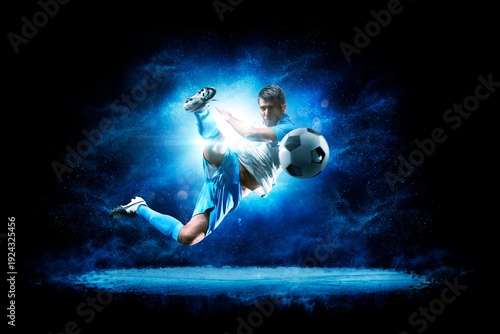 Soccer. Soccer players on a beautiful black background with a flash of light behind them. Isolated on a black background. Sports