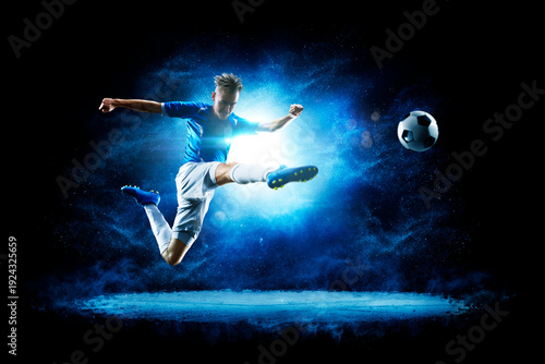 Soccer. Soccer players on a beautiful black background with a flash of light behind them. Isolated on a black background. Sports